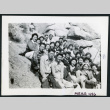 Photograph of a group of people sitting on rocks in the Sierra Nevada (ddr-csujad-47-297)