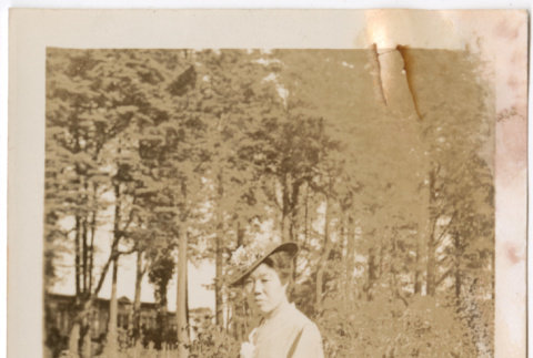 Woman standing in garden (ddr-densho-426-1441)