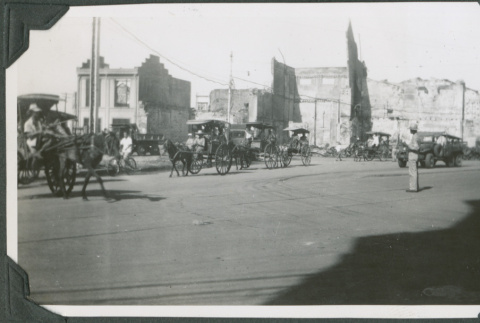 Horse drawn carriages on street (ddr-ajah-2-698)