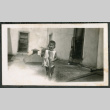 Photo of a child on a roof (ddr-densho-483-798)