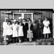 Group of workers in front of a dining hall at Tule Lake War Relocation Center (ddr-densho-474-218)