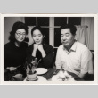 Tomoye, Masako and Henri Takahashi seated at a table (ddr-densho-426-94)