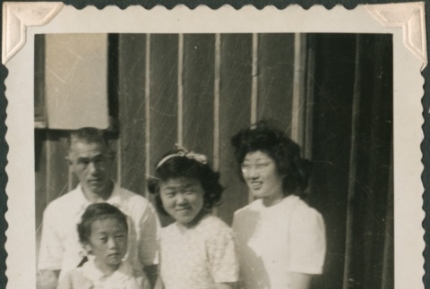 Family in front of barracks (ddr-densho-321-1024)