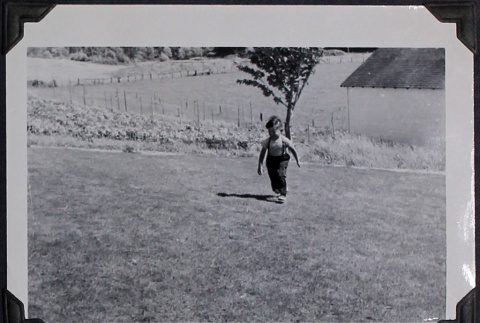 Boy running in yard (ddr-densho-359-1519)