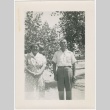 Man and woman standing in front of trees (ddr-densho-332-20)