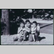 Three boys kneeling on grass (ddr-densho-330-131)