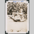 Baby sitting on toy rocking house (ddr-densho-483-572)