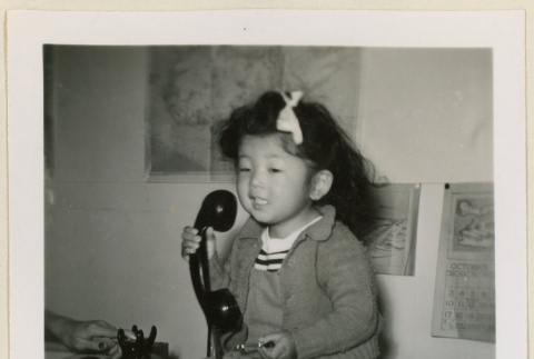 Suzanne makes a phone call (ddr-densho-37-992)