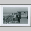 Four adults and a baby at airport (ddr-densho-293-181)