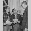 Captain William S. Fairchild discussing the army with two young Nisei volunteers (ddr-csujad-14-50)