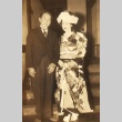 Man in a Western suit posing with woman in kimono (ddr-njpa-4-138)