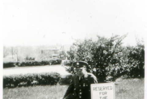 Officer sitting on lawn (ddr-densho-1007-607)