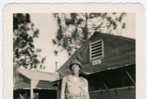 Soldier standing outside barracks (ddr-densho-368-3)