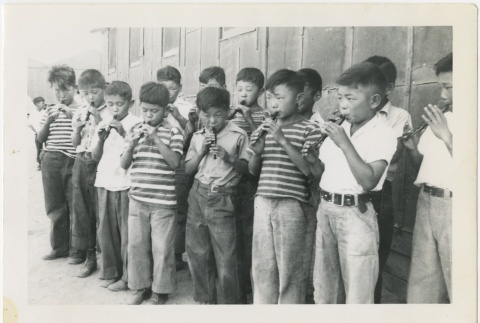 Group of boys playing recorders (ddr-manz-7-14)