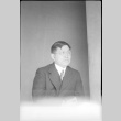 Portrait of man sitting at a table (ddr-densho-426-2008)