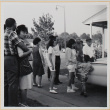 Group standing in driveway (ddr-densho-522-97)