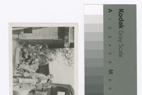 Men and children in front of a vehicle (ddr-densho-255-84)