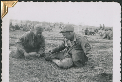Two men sitting on ground (ddr-densho-434-73)