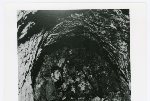 Soldier in cave (ddr-densho-1007-372)
