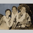 Two men and a woman wearing leis (ddr-njpa-1-486)