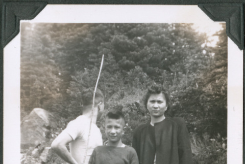 Photo of Mary, Paul, and Kenji Ima standing in a creek (ddr-densho-483-1318)