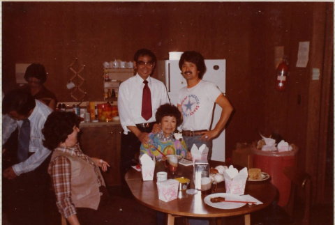 Four people around table (ddr-densho-426-1328)