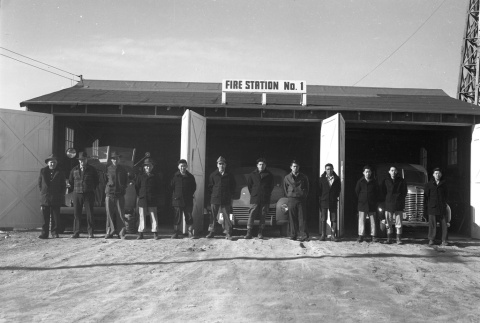 Firemen standing in front of Fire Station No. 1 (ddr-fom-1-759)