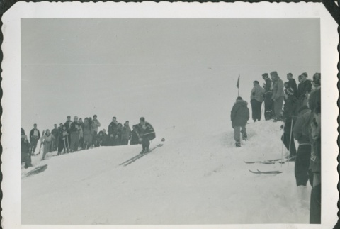 Crowd watching a skier racing (ddr-densho-321-418)