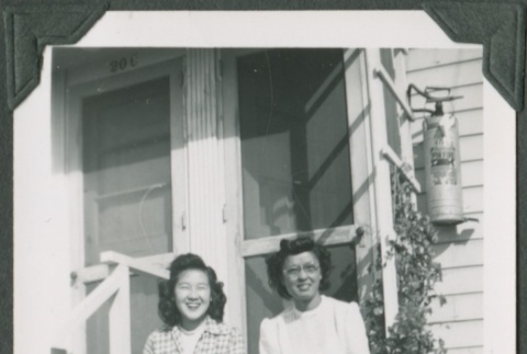 Two women sitting on front steps (ddr-densho-328-165)