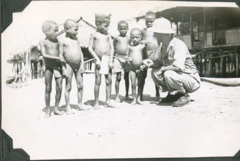 Man talking to group of children (ddr-ajah-2-627)