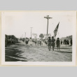 Girls Scouts march in an Armistice Day parade. (ddr-densho-37-1175)