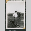 Man standing outside buildings (ddr-densho-434-316)