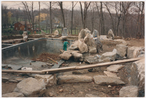 Pool with rock feature under construction (ddr-densho-377-2396)
