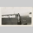 Woman standing in a camp field (ddr-manz-7-12)