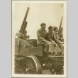 Soviet soldiers riding a cart carrying anti-aircraft guns (ddr-njpa-13-432)