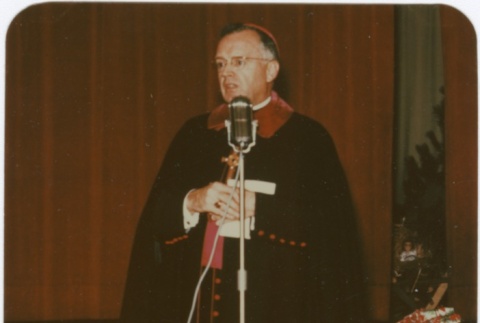 Priest speaking at microphone (ddr-densho-330-285)