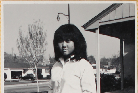 Girl holding flower (ddr-densho-522-128)