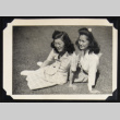 Two women lounge on a lawn (ddr-densho-542-703)