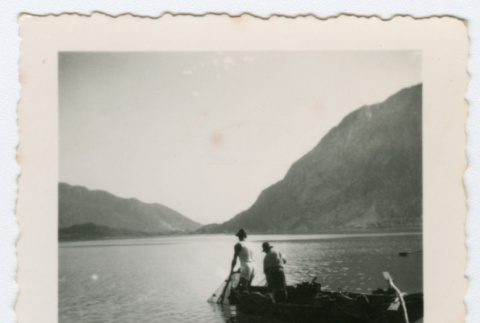 Men in small boat on lake in Italy (ddr-densho-368-59)
