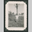 Woman poses in front of a tree (ddr-densho-471-95)