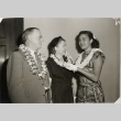 Miss Hawaii and a man and woman wearing leis (ddr-njpa-2-844)
