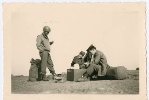 Soldiers socializing outside at camp (ddr-densho-368-136)