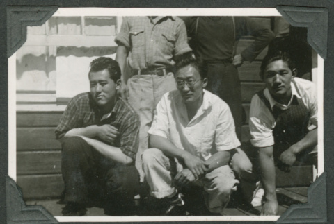3 men crouching (ddr-densho-540-74)