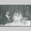 Bride and groom at a table at reception (ddr-densho-523-352)