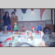 Man and woman standing in front of table (ddr-densho-426-1170)