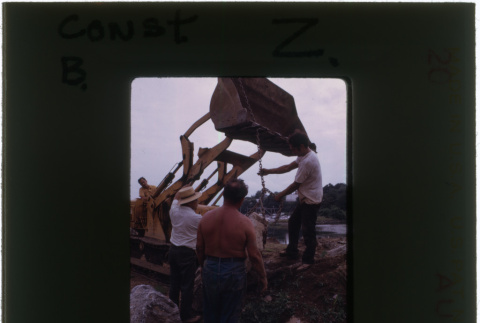 Men working on rock garden construction (ddr-densho-377-912)