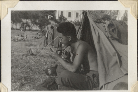Man shaving outside tent (ddr-densho-466-643)