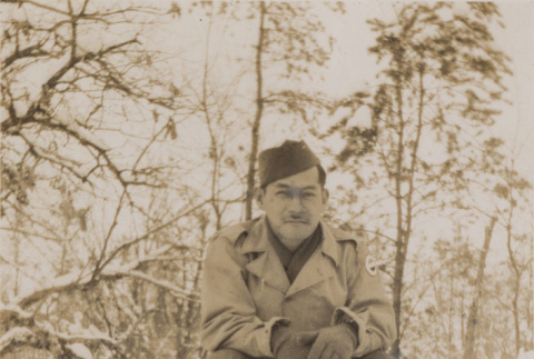 Soldier squatting in snow (ddr-janm-17-43)