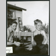 Photograph of Elizabeth Moxley and a young boy at Manzanar (ddr-csujad-47-284)