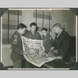 Four men looking at map (ddr-ajah-2-731)